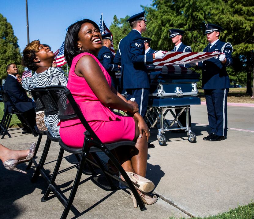 Gai Spann, left, and Dr. Carla Spann Lopez, center, smile as military planes fly overhead...