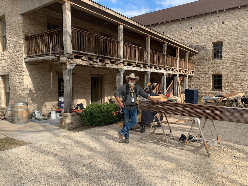 Former Dallas radio personality Jody Dean works on a TV set in Glen Rose.