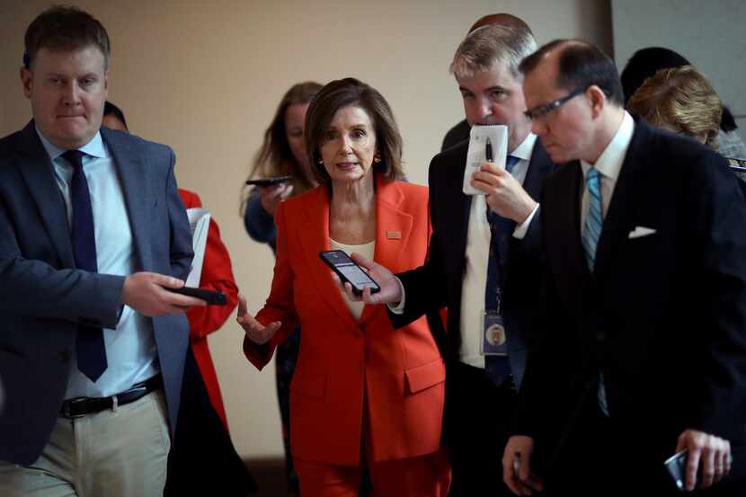 U.S. Speaker of the House Nancy Pelosi, D-Calif., is trailed by reporters following her...