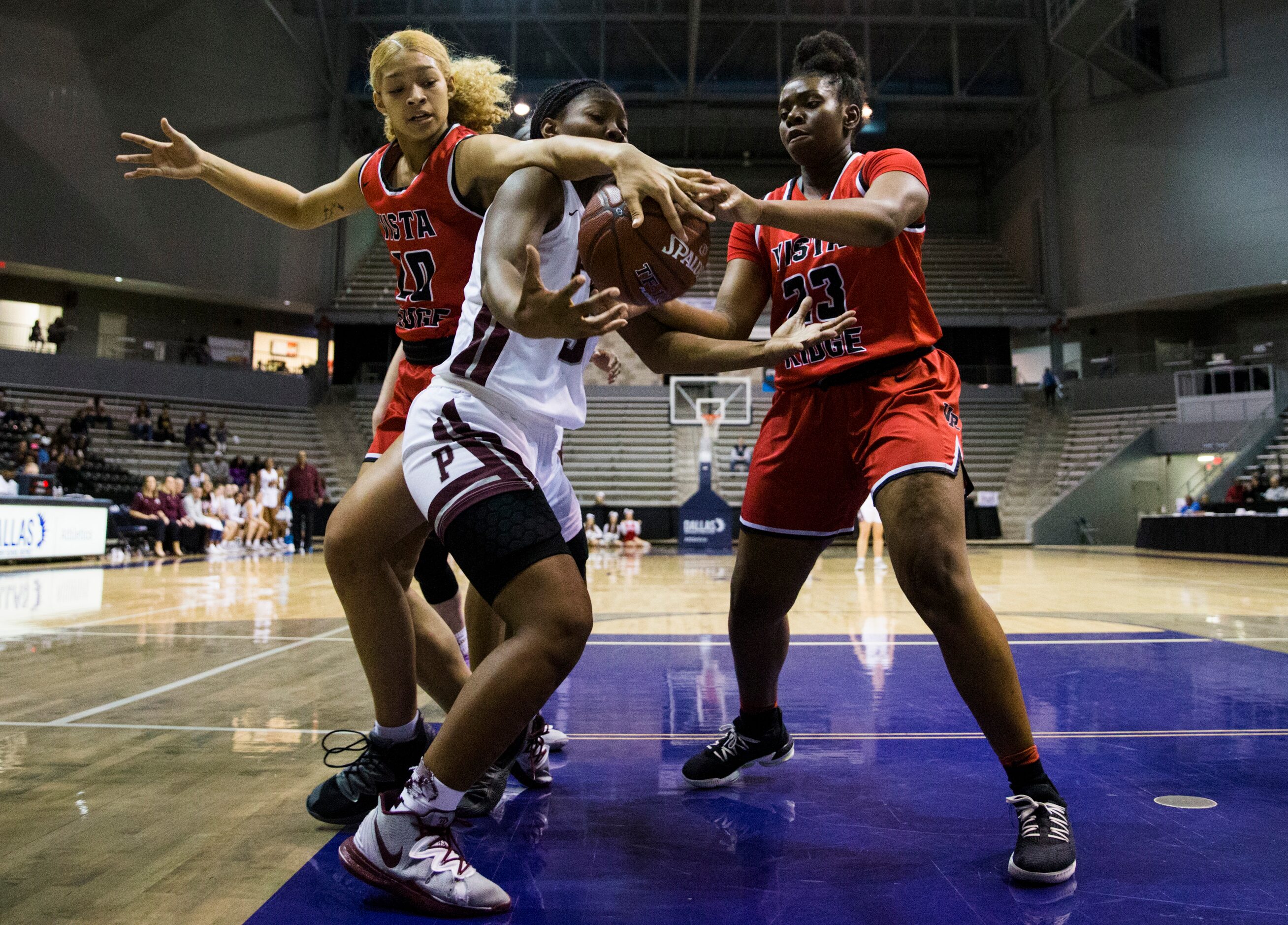 Plano guard Sanaa Murphy-Showers (32) fights for a rebound with Cedar Park Vista Ridge...