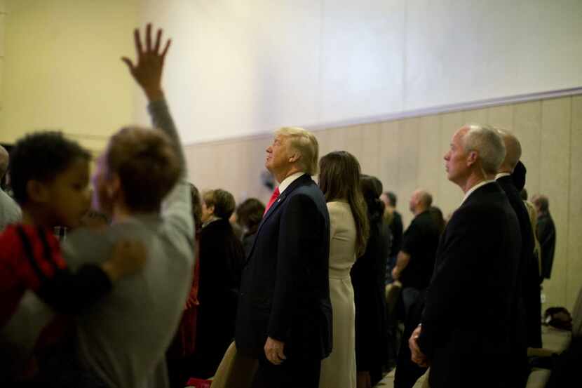 Republican presidential candidate Donald Trump, center, attends a Sunday service with his...