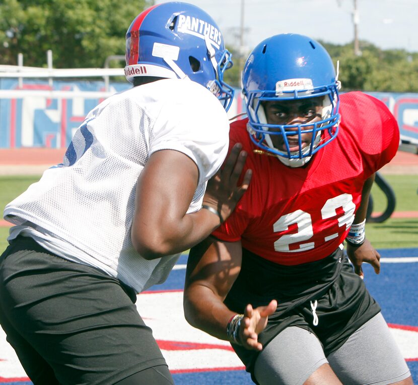 Duncanville Panthers defensive lineman Omari Abor (23) eyes the quarterback as he works...