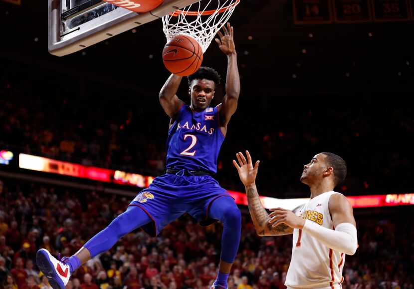 AMES, IA - JANUARY 16: Lagerald Vick #2 of the Kansas Jayhawks dunks the ball as Nick...