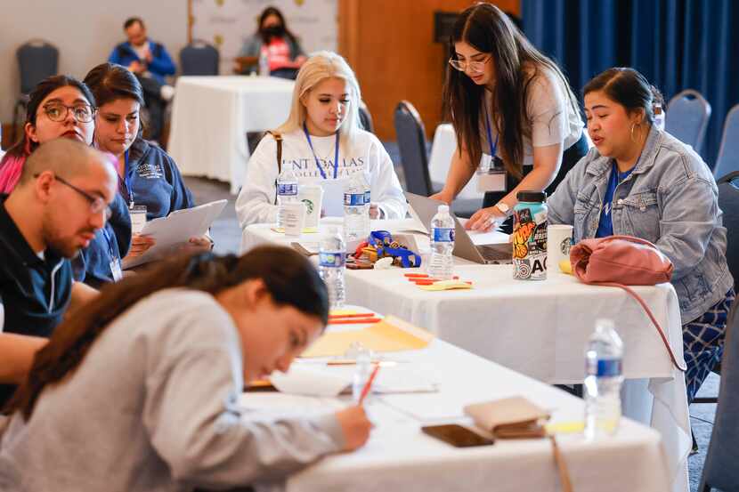 Emma Chalott (right) leads a segment during DACA Renewal Workshop on Saturday, April 22,...