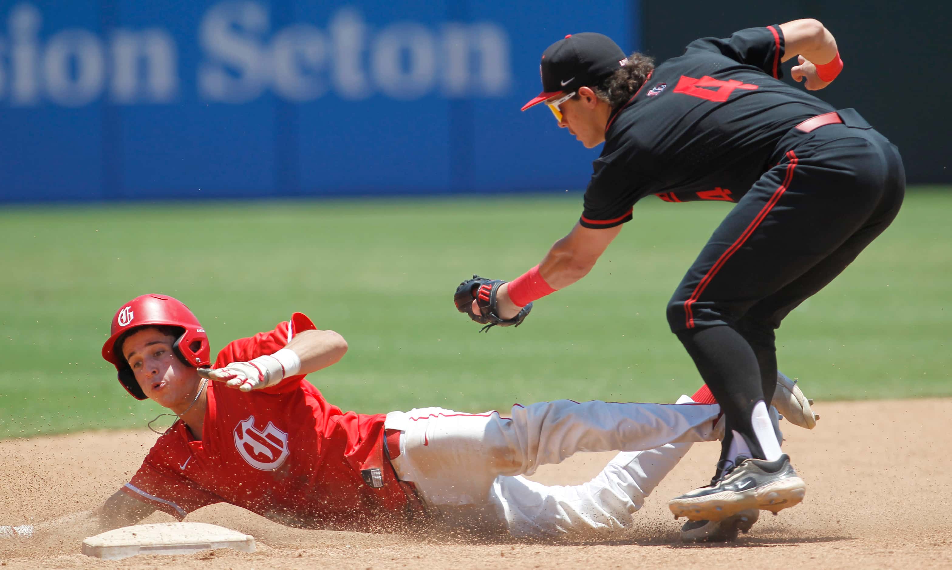 Grapevine baserunner Brenton Lee (4) is tagged out by Lovejoy shortstop Kyle Branch (4)...