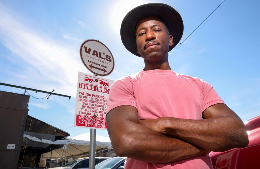  Valery Jean-Bart stands in front of the parking sign at his Val's Cheesecakes on Greenville...