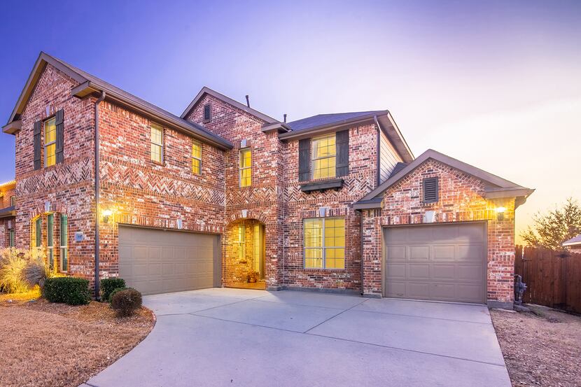 The residence at 6409 Tuckers Place in Rowlett is offered for $469,900. It will be held open...