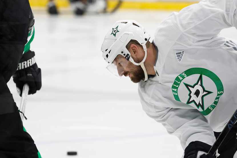 Dallas Stars left wing Blake Comeau works on a face off during a training camp practice at...
