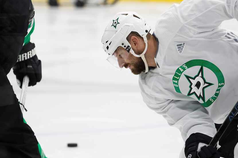 Dallas Stars left wing Blake Comeau works on a face off during a training camp practice at...