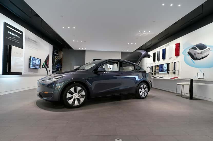 A Tesla Model Y Long Range is displayed at the Tesla Gallery in Troy, Mich. Gas-electric...
