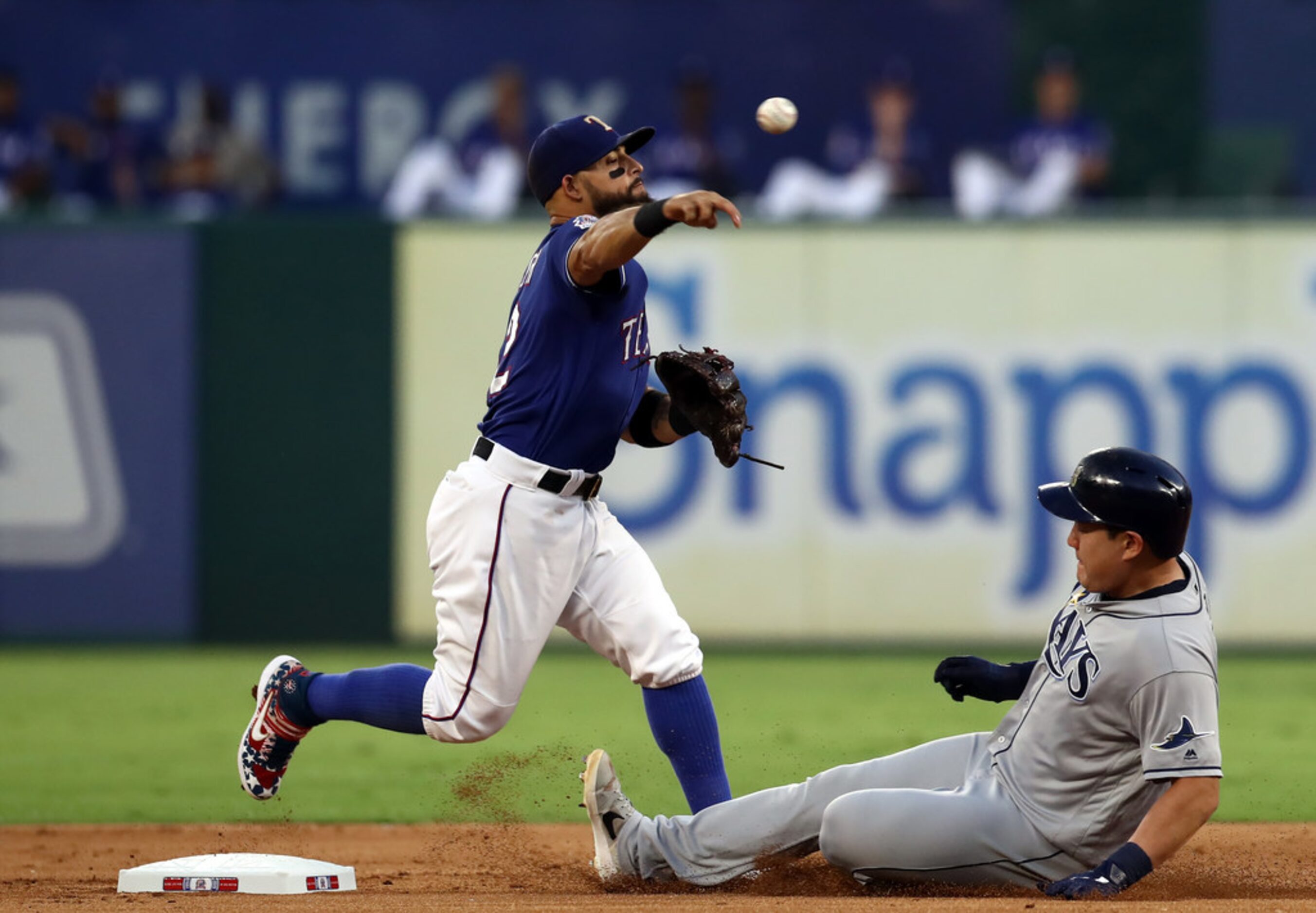 ARLINGTON, TEXAS - SEPTEMBER 10:  Rougned Odor #12 of the Texas Rangers makes the out...