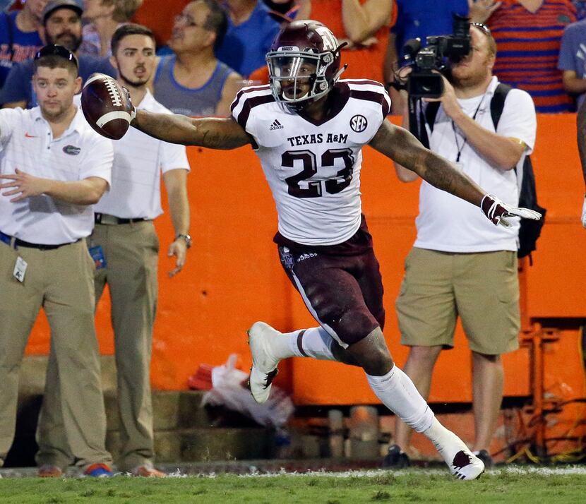 Texas A&M defensive back Armani Watts celebrates after intercepting a Florida pass during...