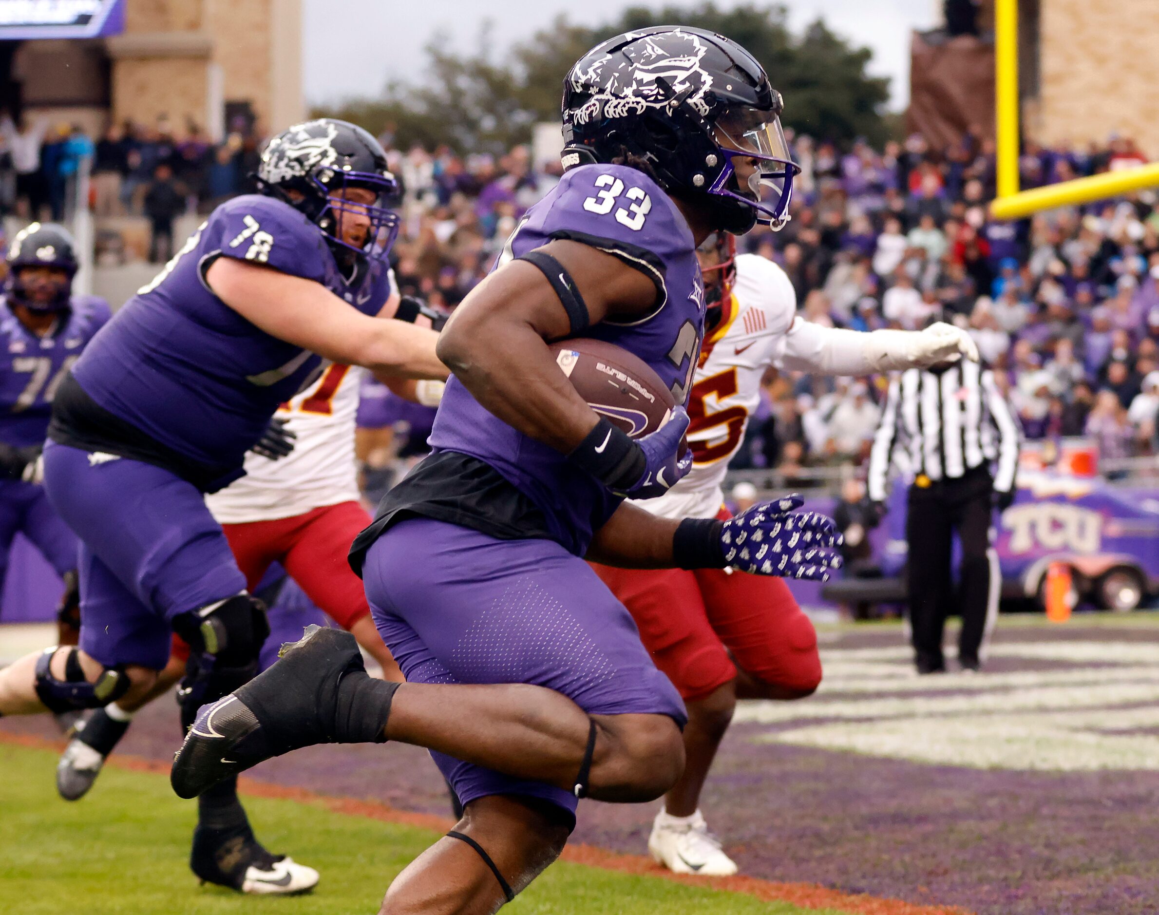 TCU Horned Frogs running back Kendre Miller (33) carries the ball in for a late second...