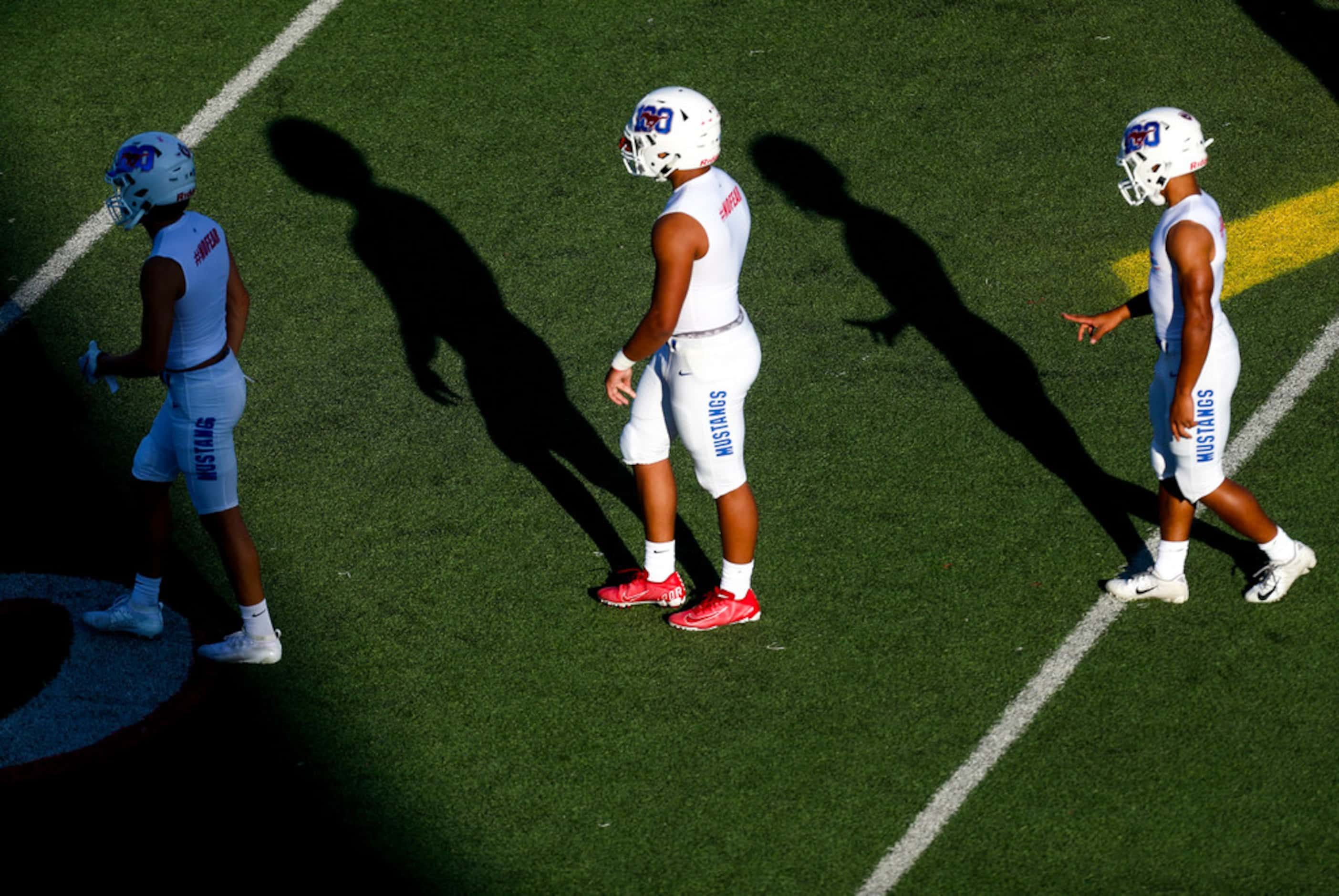 Grapevine players warm up before a high school football game between Northwest and Grapevine...