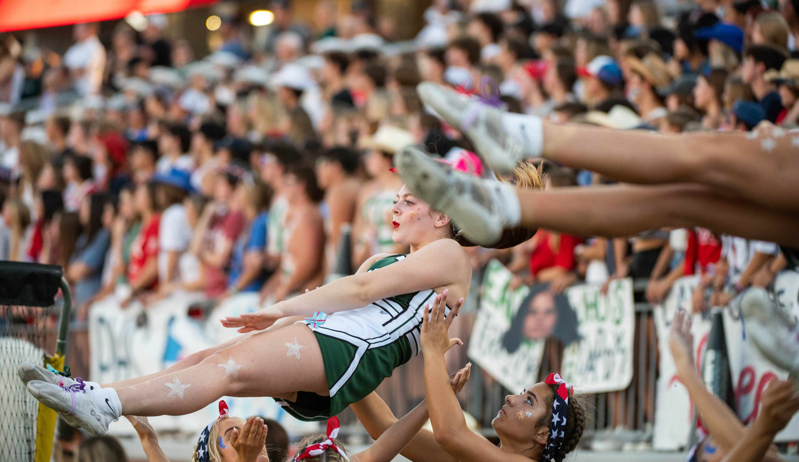 Prosper cheerleaders perform in the first half during a high school football against...