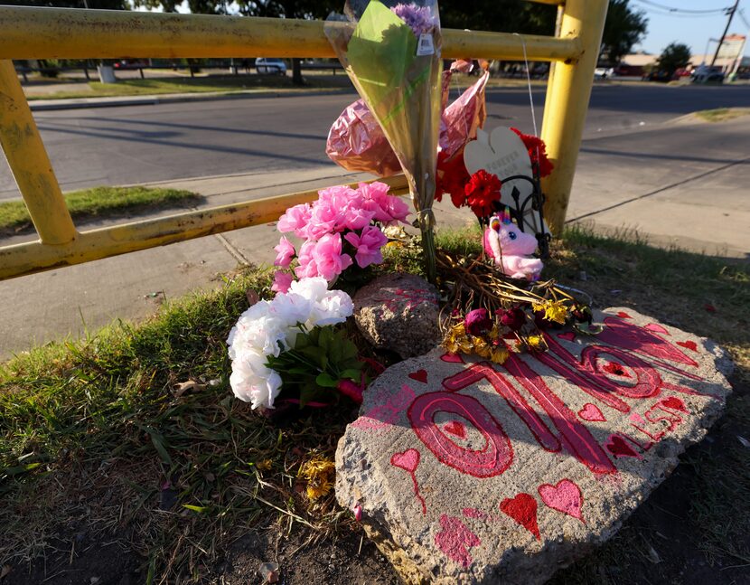 A rock, painted with the date when Shaniah Jones, 24, was fatally shot last week, sits in a...