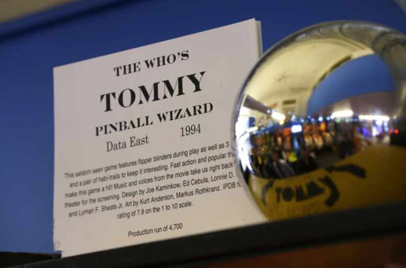 In this Dec. 16, 2013 photo, an information card from the 1994 The Who's Tommy pinball...