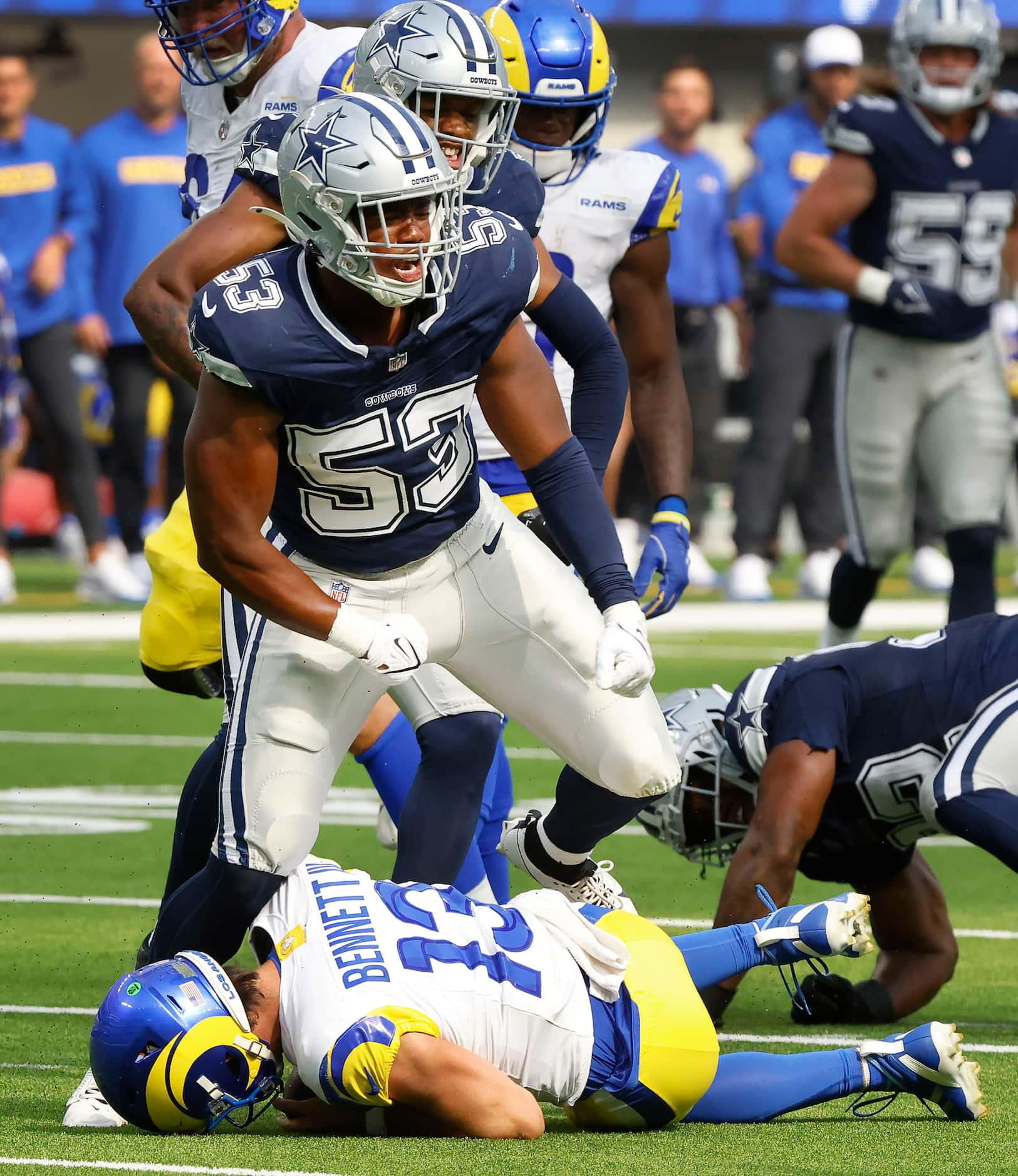 Dallas Cowboys linebacker Jason Johnson (53) celebrates his sack of Los Angeles Rams...