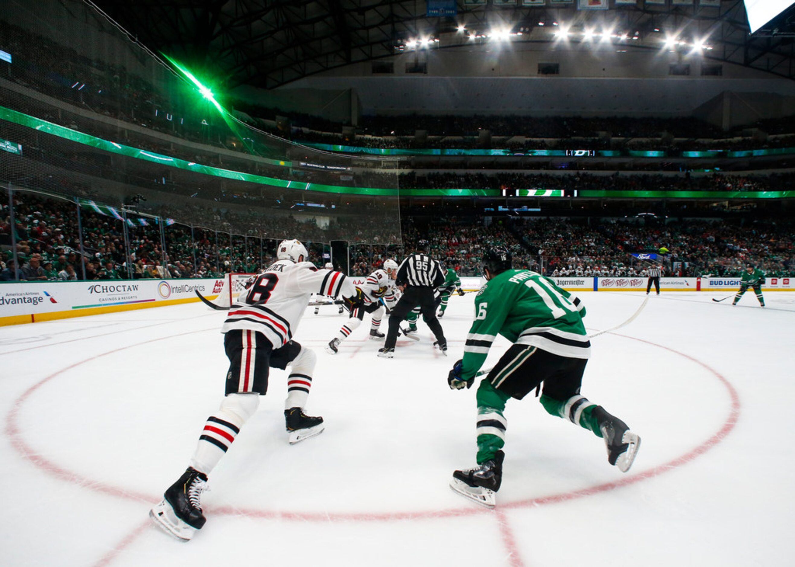 The Dallas Stars battle the Chicago Blackhawks for control during the first period of an NHL...