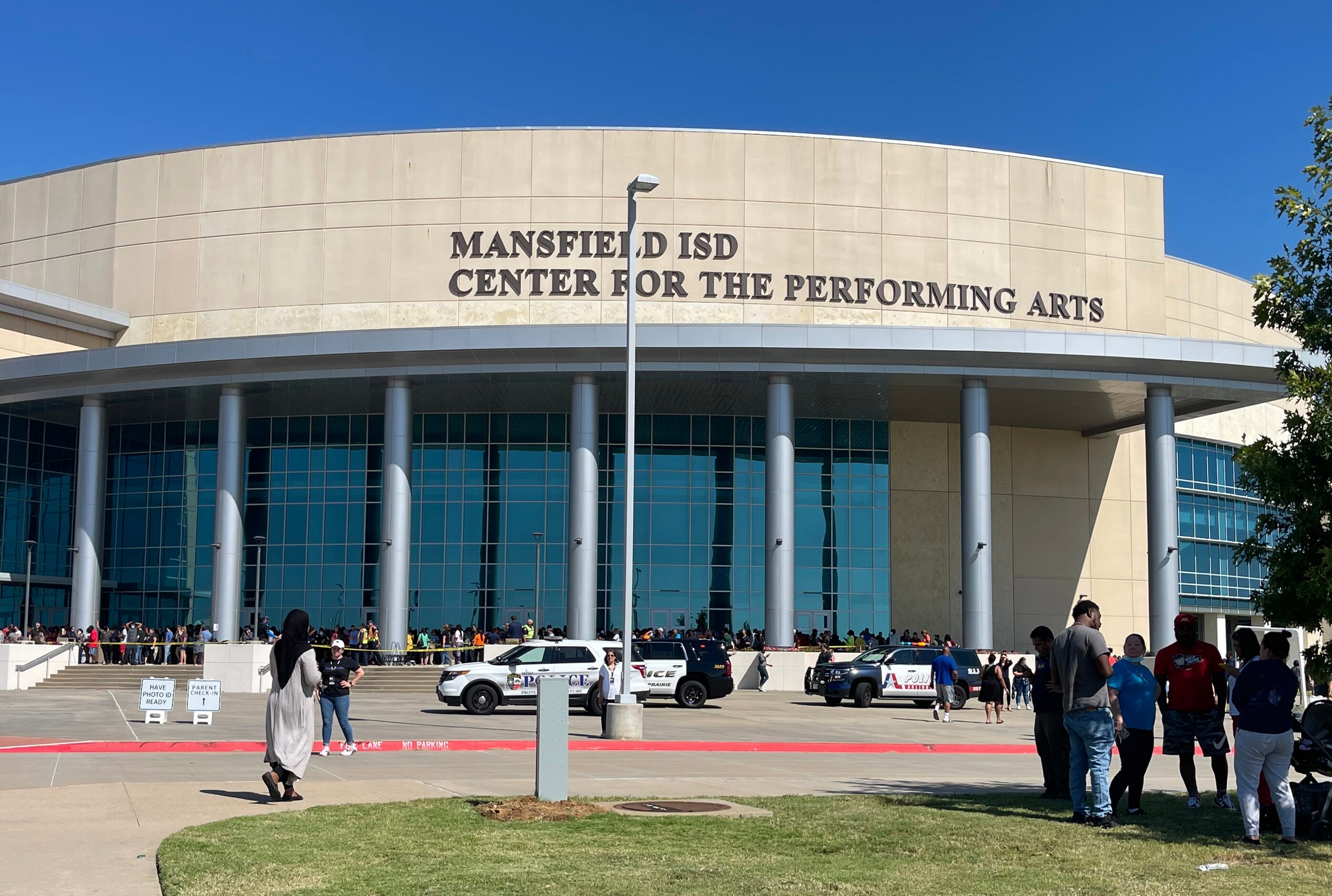 Parents of Timberview High School students wait outside of the Mansfield ISD Center for The...