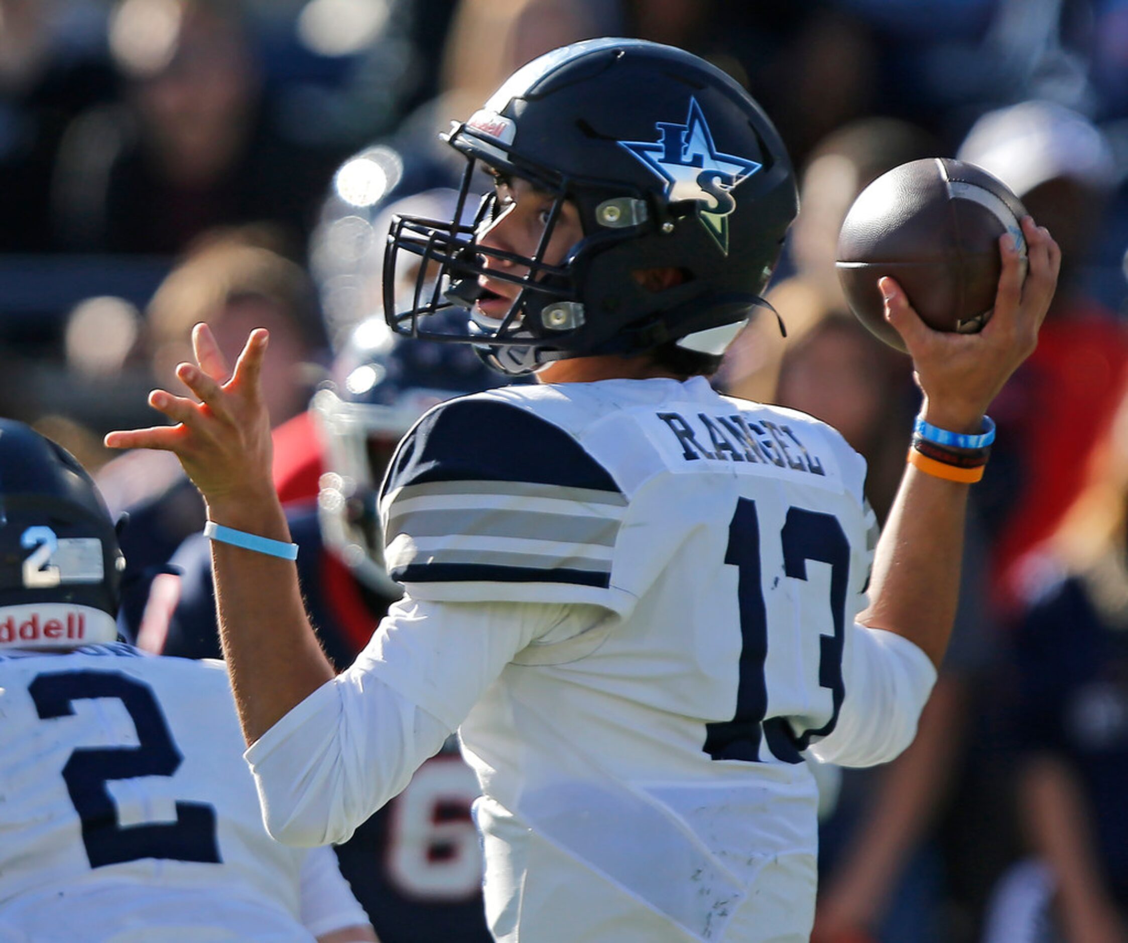 Lone Star High School quarterback Garret Rangel (13) throws a pass during the first half as...