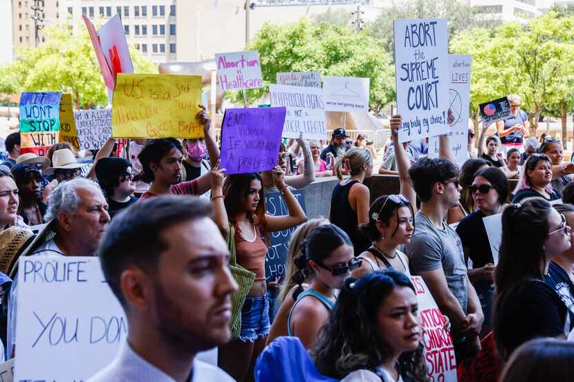 Abortion rights supporters gather at the Dallas City Hall in downtown Dallas on Wednesday,...