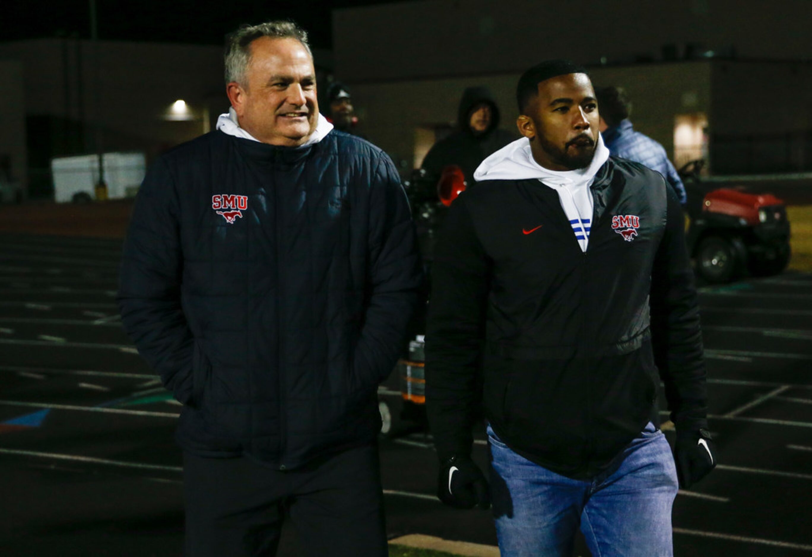 Southern Methodist head football coach Sonny Dykes, left, and assistant receivers coach...