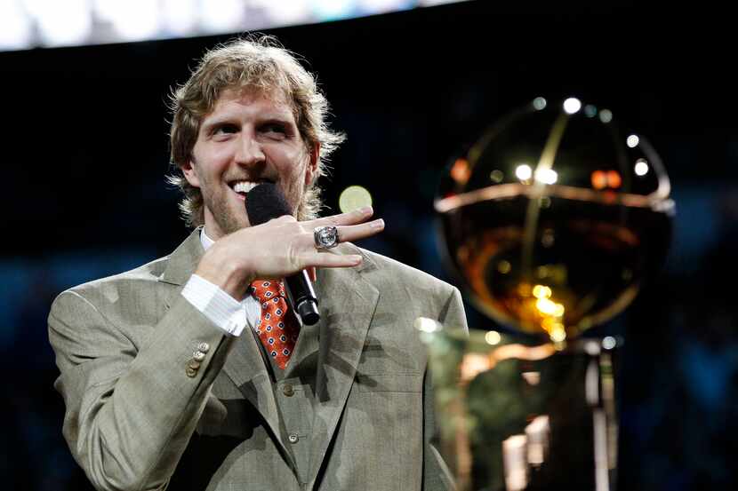 Dirk Nowitzki shows off his NBA championship ring.
