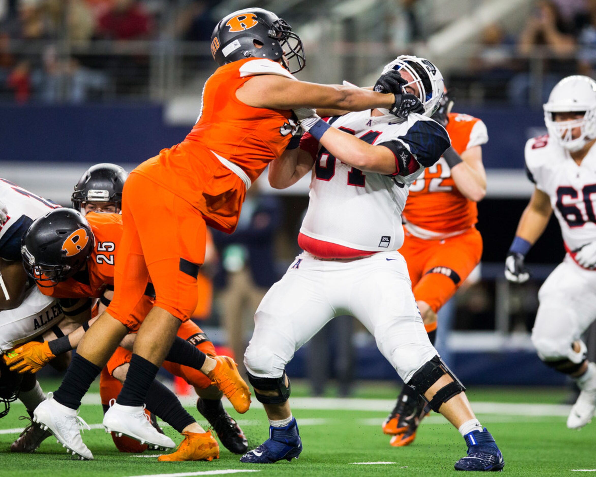 Rockwall defensive tackle Sebastian Hinojosa (95) gets ahold of Allen offensive lineman...