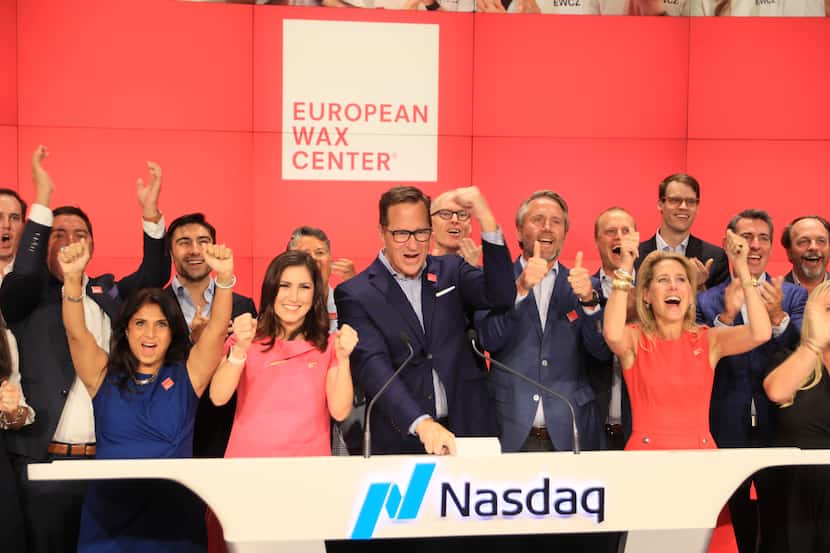 European Wax Center CEO David Berg (center) celebrated with employees when the company began...