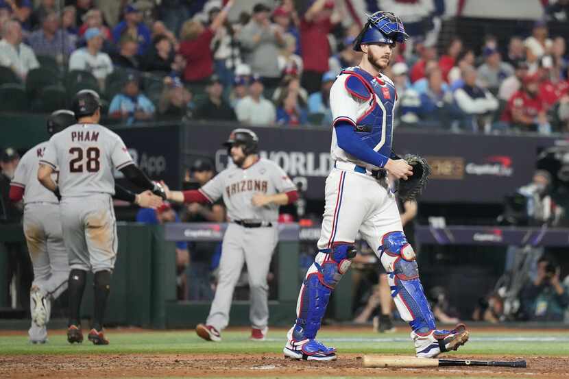 Texas Rangers catcher Jonah Heim reacts after a two-run single by Arizona Diamondbacks'...