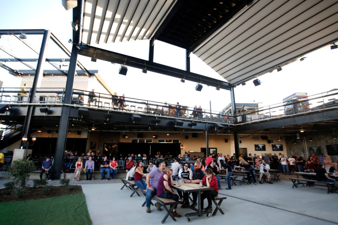 Tables are placed in front of the main stage at Lava Cantina in The Colony.