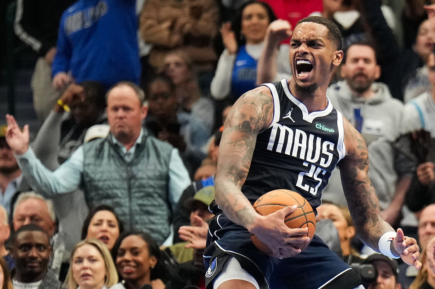 Dallas Mavericks forward P.J. Washington reacts after tying up Memphis Grizzlies forward...