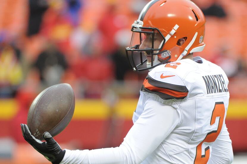 Cleveland Browns quarterback Johnny Manziel (2) balances a football before an NFL football...