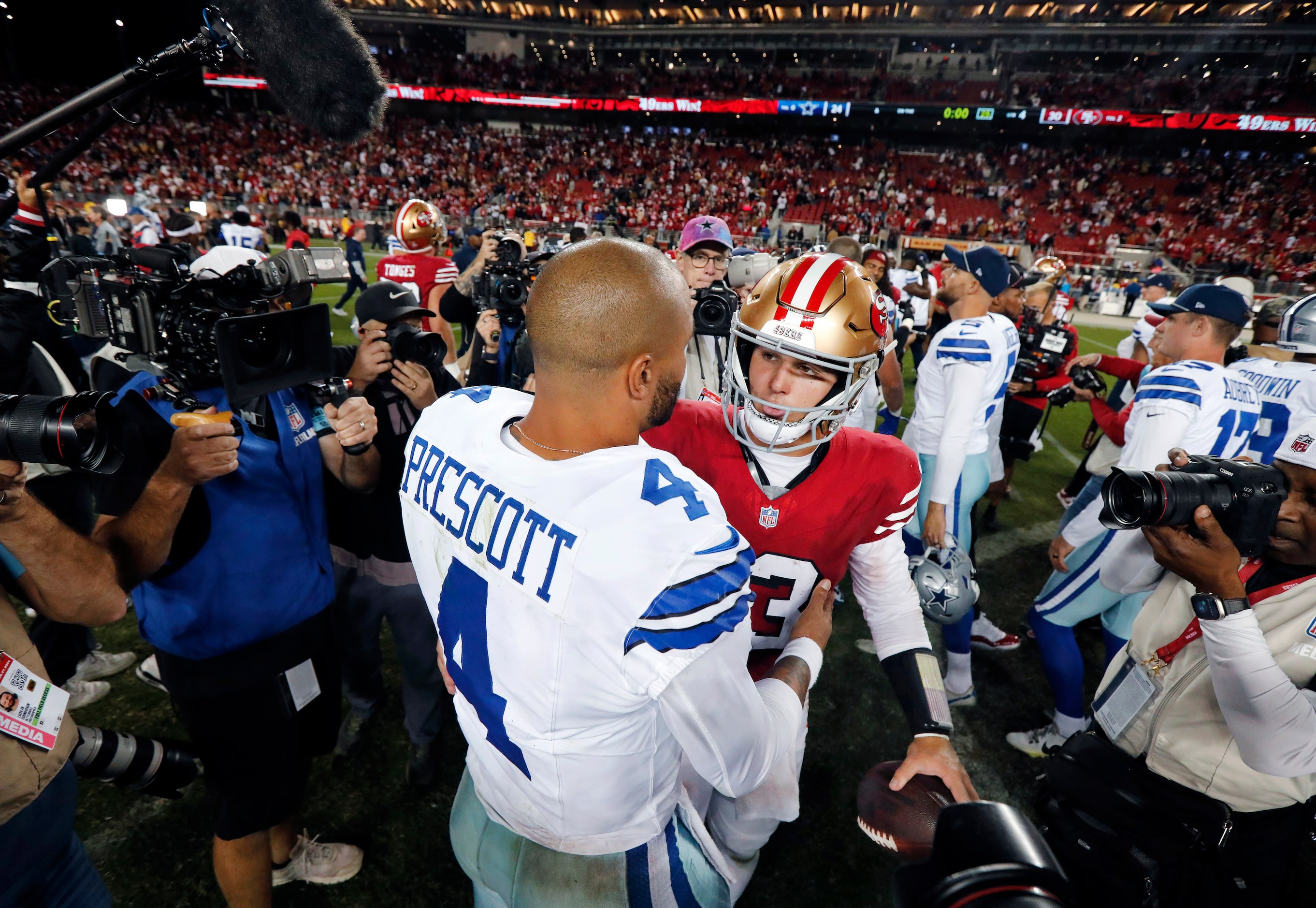 San Francisco 49ers quarterback Brock Purdy (13) shakes hands with Dallas Cowboys...