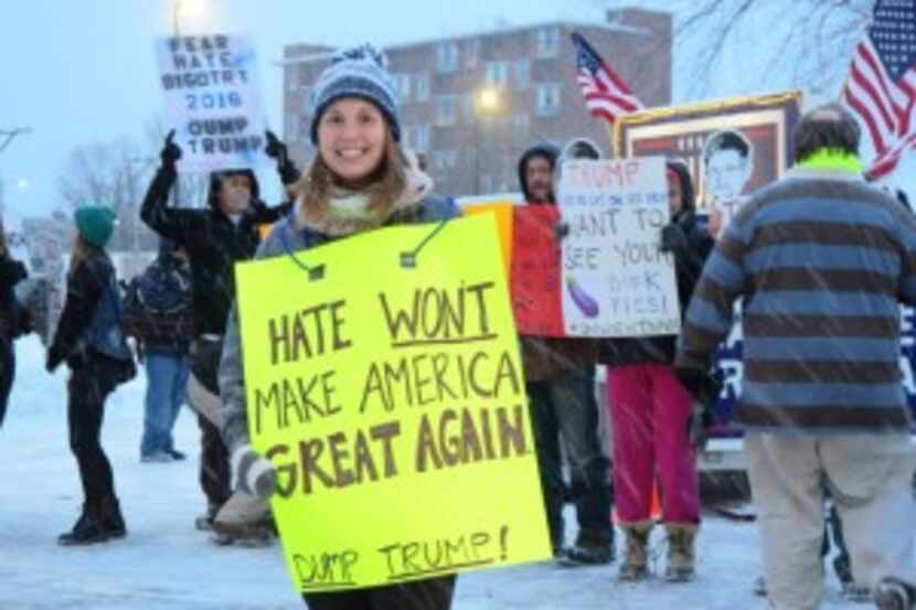 Protesters brave snow and subfreezing coldÂ outside a Trump rally in Manchester on Monday...
