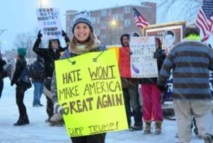  Protesters brave snow and subfreezing coldÂ outside a Trump rally in Manchester on Monday...