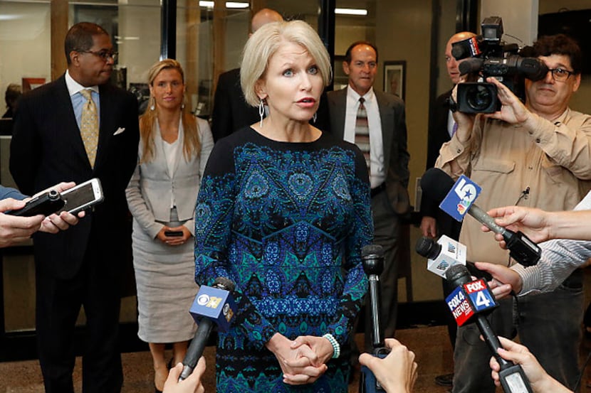 Dallas District Attorney Susan Hawk talks to reporters outside her office at the Frank...