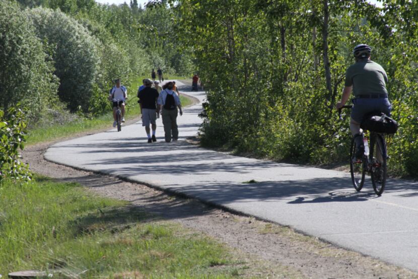 This photo taken June 11, 2013, shows people using the Tony Knowles Coastal Trail in...