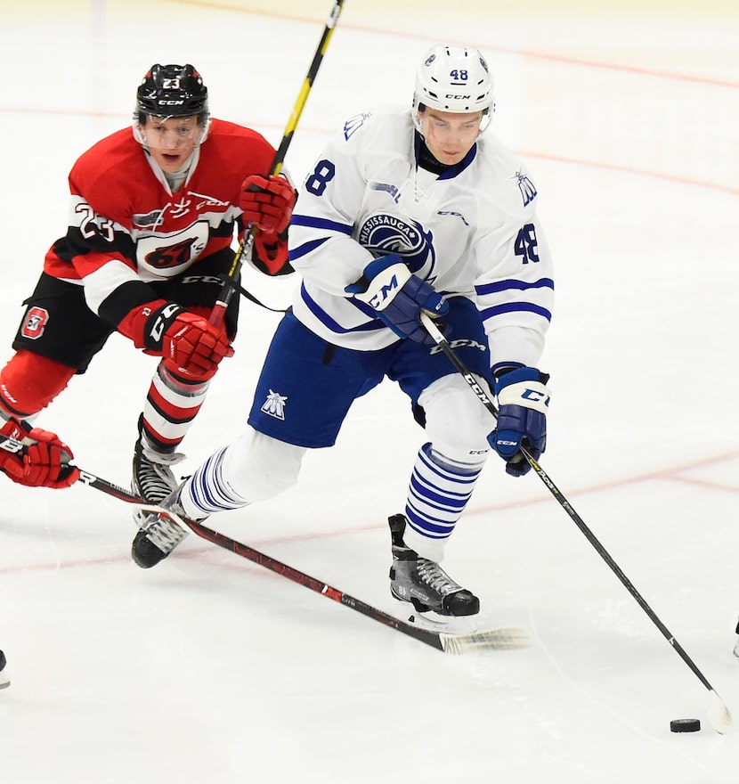 MISSISSAUGA, ON - OCTOBER 21: Thomas Harley #48 of the Mississauga Steelheads battles for...