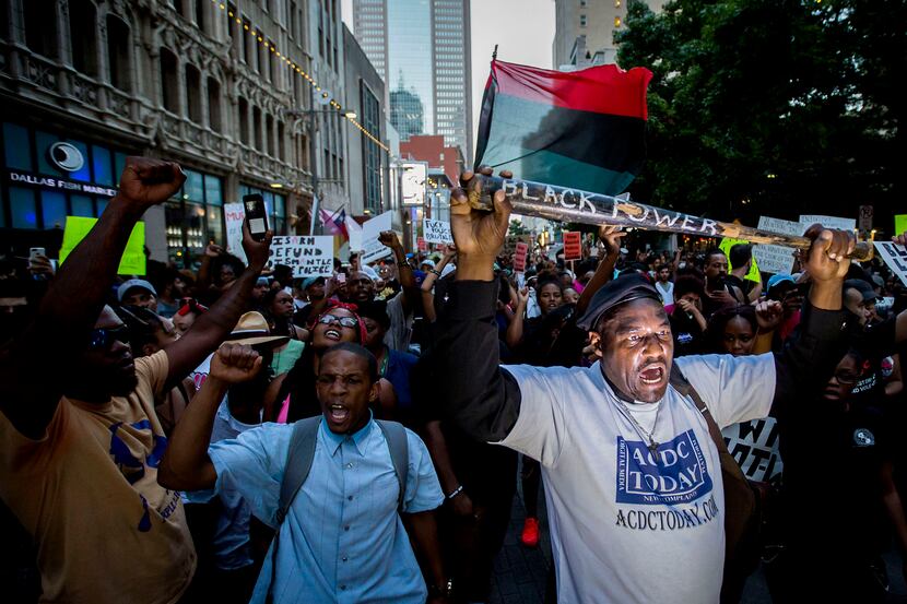 Ernest Walker led other protesters at a rally in downtown Dallas on Thursday. Protesters...
