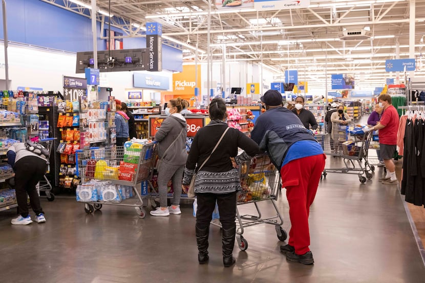 Shoppers check out at the Walmart on Short Boulevard in Dallas on Tuesday. 