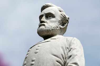 A statue of Gen. Robert E. Lee stands at the Confederate War Memorial in Dallas. Following...