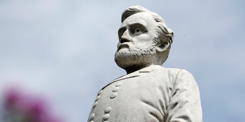 A statue of Gen. Robert E. Lee stands at the Confederate War Memorial in Dallas. Following...