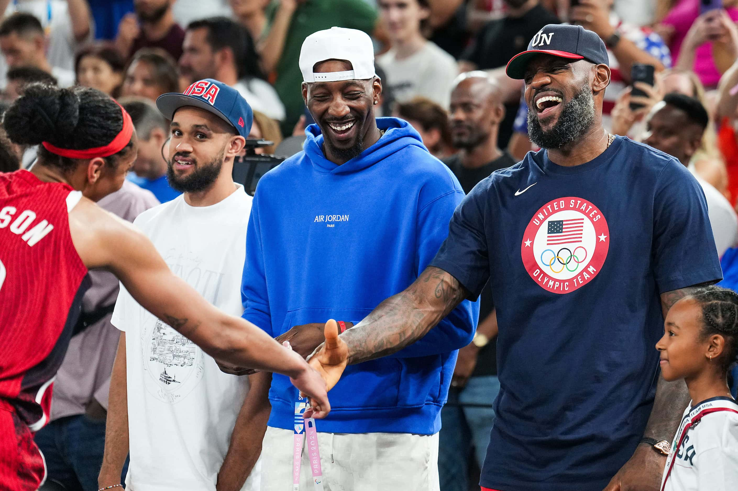 A'Ja Wilson (left) of the United States celebrates withLeBron James after a victory over...