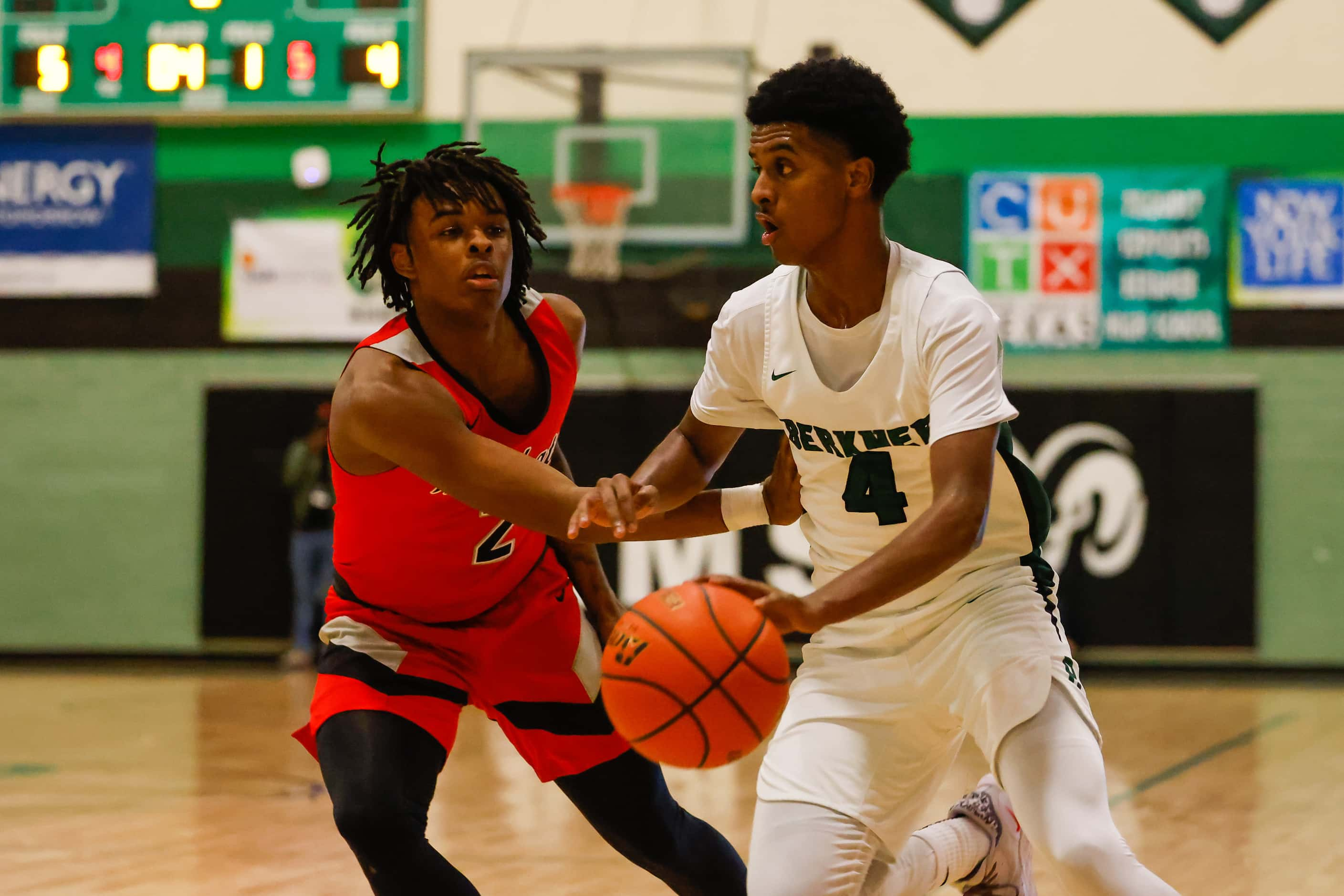 Berkner High School' Adonai Rezene #4 tries to pass a block from Lake Highlands High School'...