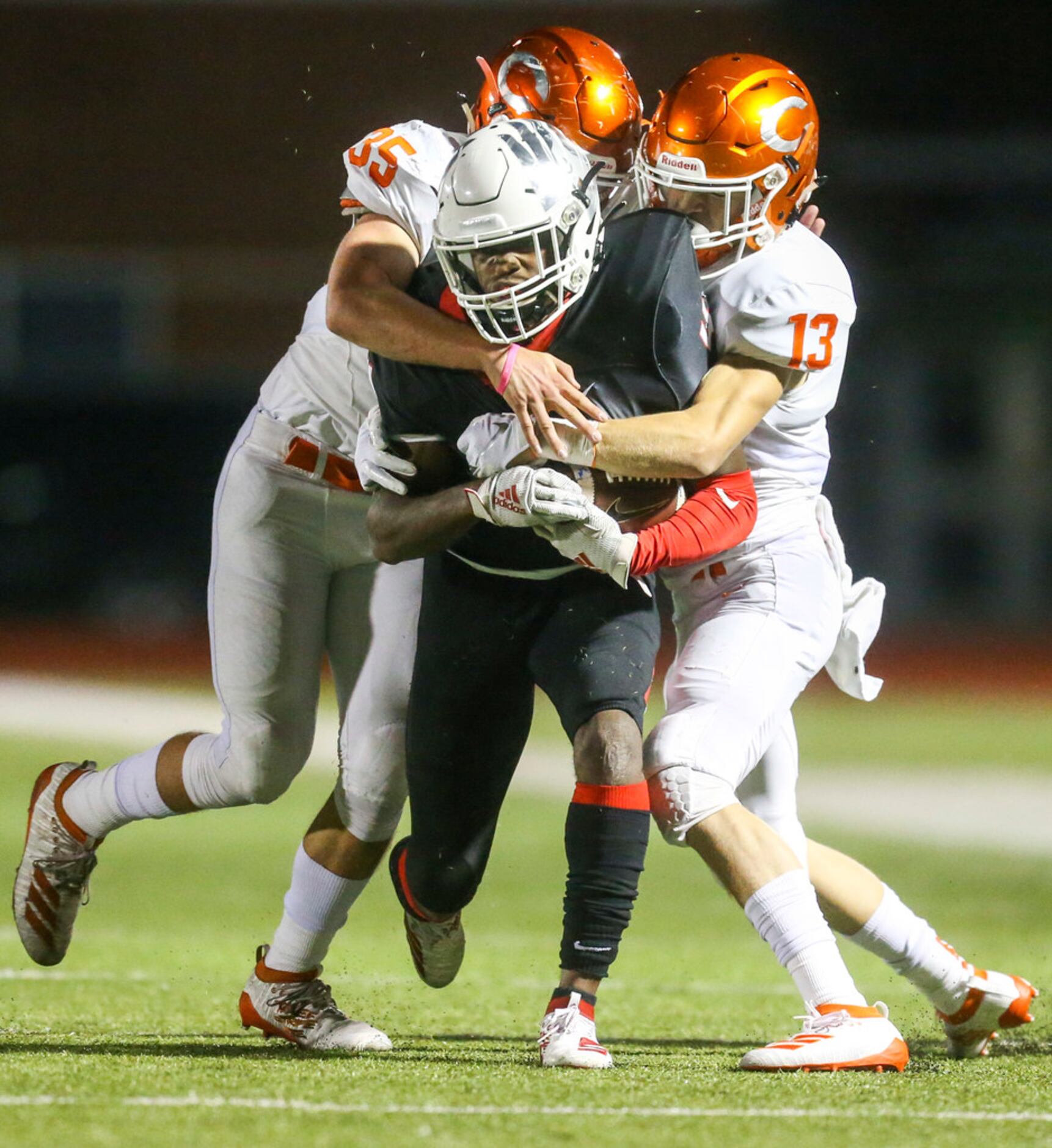 Melissa wide receiver Chase Mapps (4) carries the ball as he is defended by Celina...