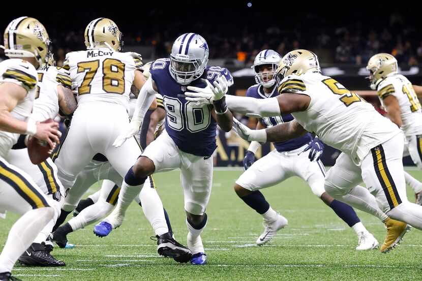 Dallas Cowboys defensive end Demarcus Lawrence (90) tries to get to New Orleans Saints...