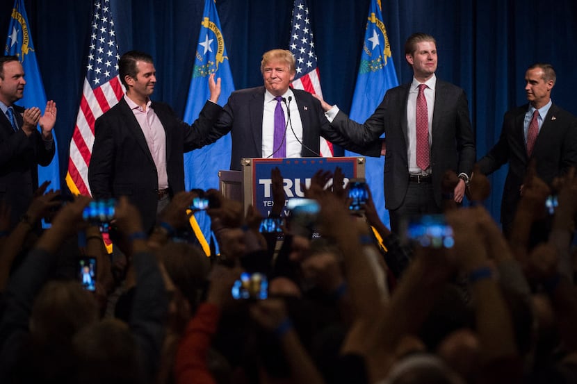 Donald Trump, center, speaks during a campaign event in Las Vegas on Feb. 23, 2016, the day...