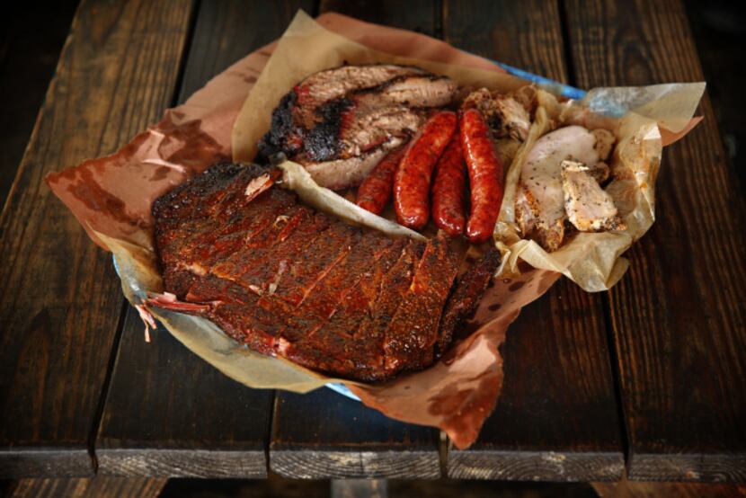 A healthy portion of turkey, sausage brisket, pulled pork and ribs are served at Franklin...